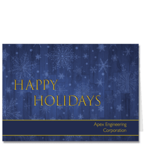 Corporate holiday card features a blue hued barn wood background with stylized snowflakes and your company name.