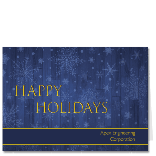 Corporate holiday card features a blue hued barn wood background with stylized snowflakes and your company name.