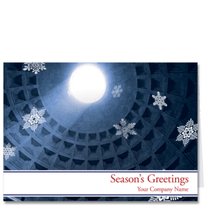 These corporate holiday cards for business depict a skyward look up to the oculus of the Pantheon in Rome in hues of indigo blue. Floating snowflakes accent your choice of holiday sentiment and your company name on the lower edge of the card.