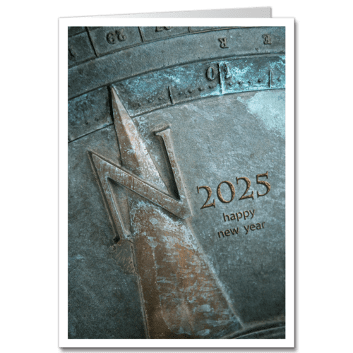 Elegant Happy New Year card depicting image of a verdigris aged sun dial holiday card.